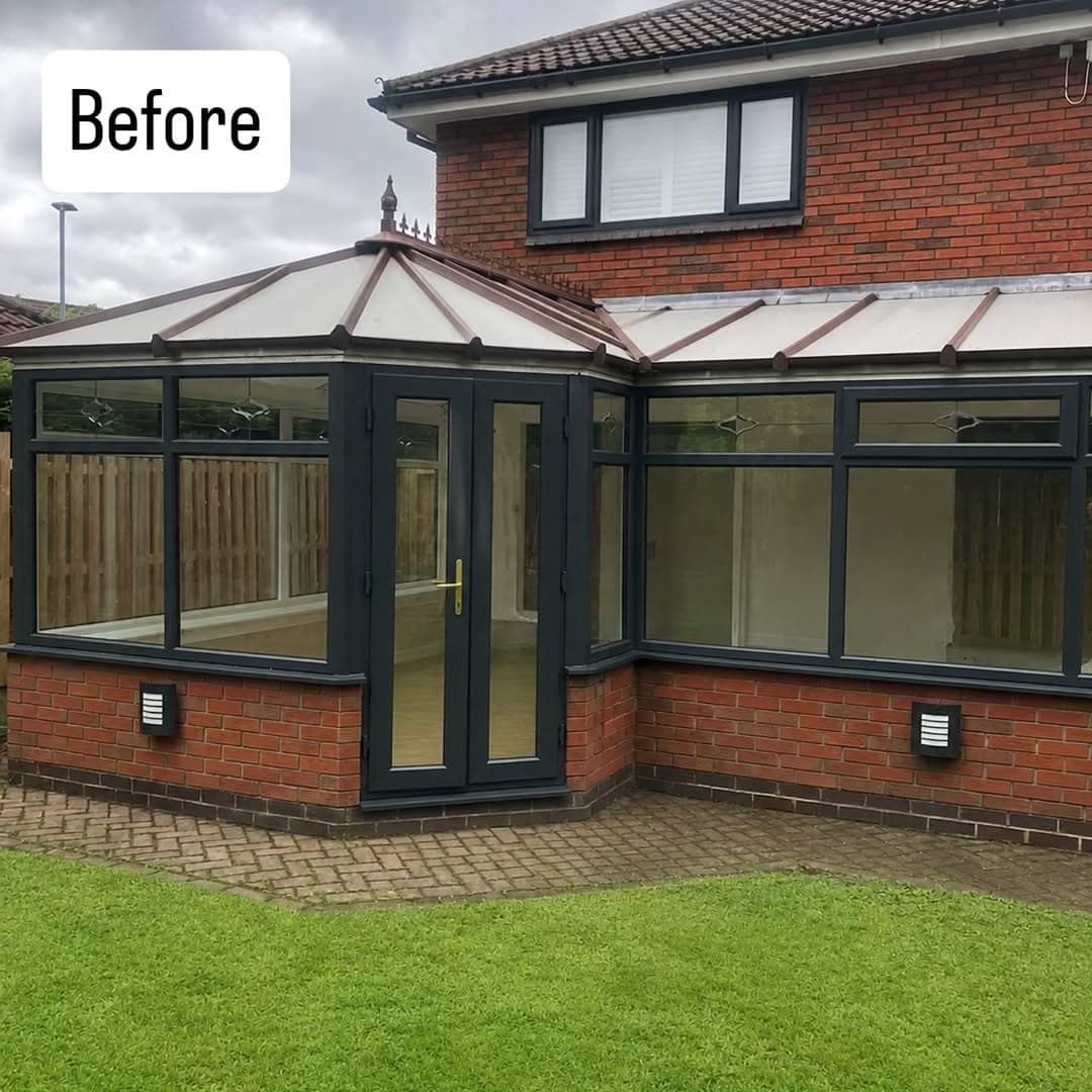 Red brick house with an existing conservatory, its original glazed roof and anthracite grey frames, before a warm roof conversion